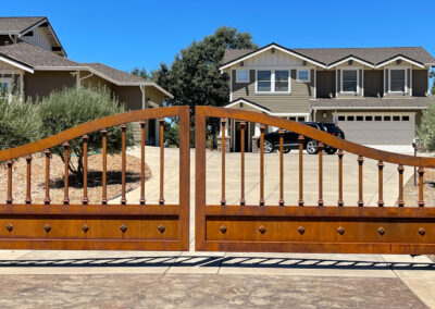 Bell Curve Bi-Parting Driveway Gate w/ Natural Bare Metal Patina, Bold Pickets, Knuckles & Diamond Accented Bottom Panel