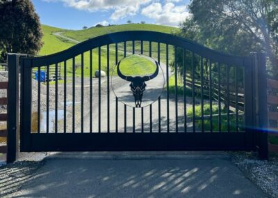 Bell Curve Driveway Gate w/ Horned Bull Skull Center Window