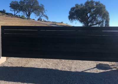 Flat Top Driveway Gate w/ Horizontal Wood Slats & Decorative Rivets