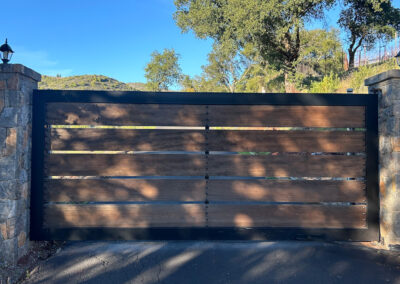 Flat Top Driveway Gate w/ Metal Frame, Wood Horizontal Slats & Decorative Bolt Heads